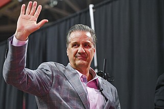 Arkansas men’s basketball coach John Calipari waves to the crowd as he exits during an introductory news conference event at Bud Walton Arena in Fayetteville on April 10, 2024. (NWA Democrat-Gazette/Hank Layton)